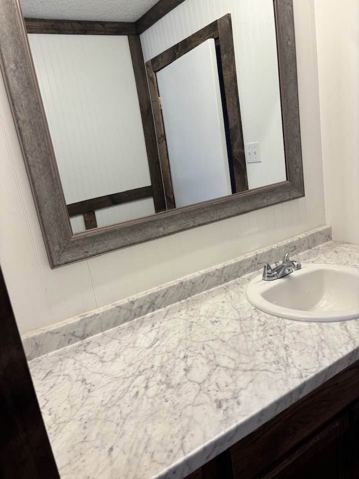 Second bathroom vanity with marble-look countertop