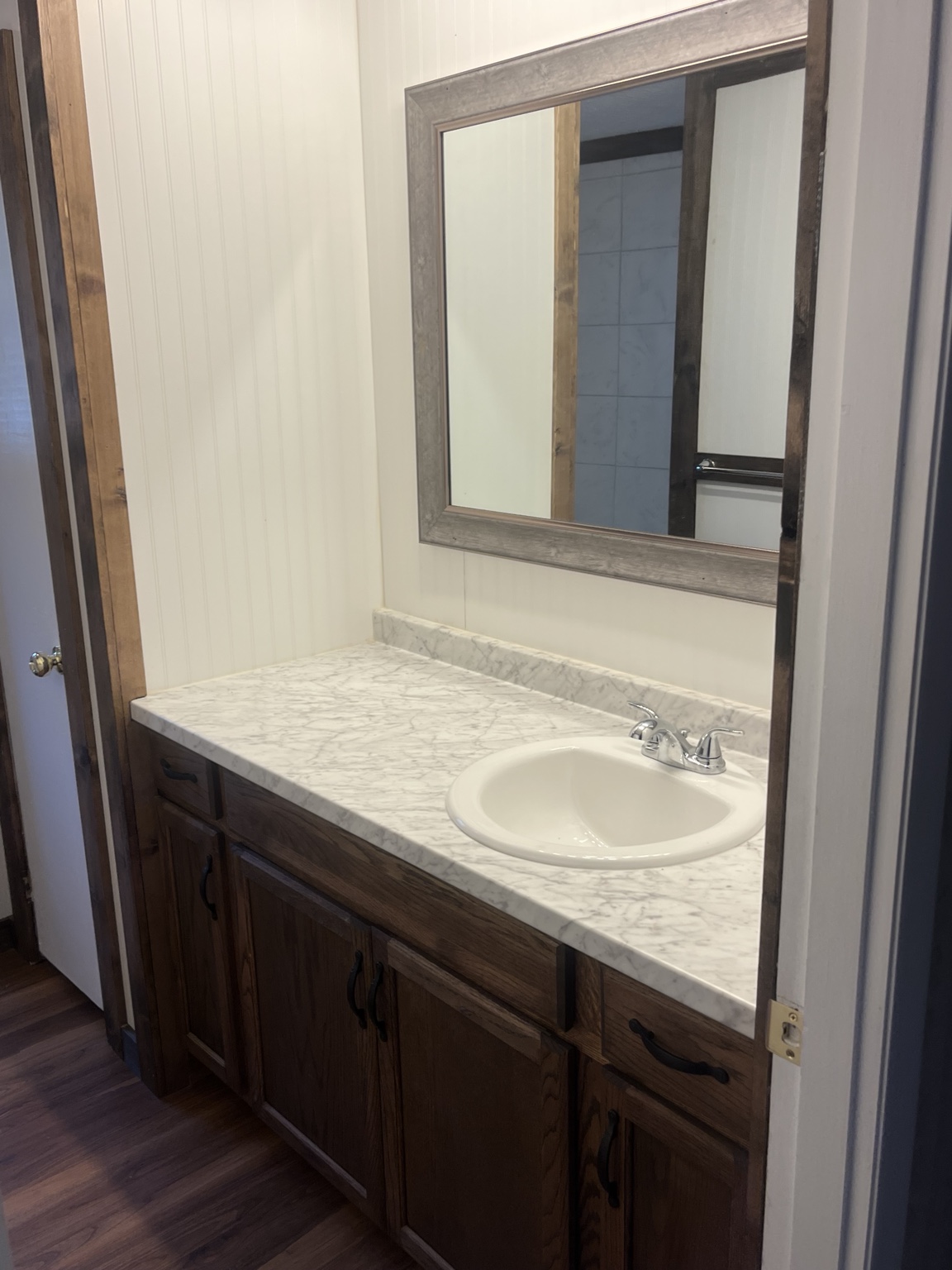 Bathroom vanity with marble-look countertop
